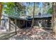 Dark gray house with metal roof, walkway, and landscaping at 17210 Orangewood Dr, Lutz, FL 33548