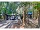 Charming house exterior with a two-car garage and a lush green landscape at 17210 Orangewood Dr, Lutz, FL 33548