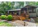 Lakefront home with large deck and lush landscaping at 17210 Orangewood Dr, Lutz, FL 33548