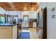 Modern kitchen with stainless steel appliances and wood ceiling at 17210 Orangewood Dr, Lutz, FL 33548