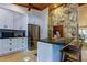 Modern kitchen features white cabinets, stone backsplash, and stainless steel appliances at 17210 Orangewood Dr, Lutz, FL 33548