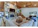 Spacious living room with a stone fireplace and vaulted wood ceilings at 17210 Orangewood Dr, Lutz, FL 33548