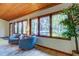 Cozy living area with lake view and comfortable seating at 17210 Orangewood Dr, Lutz, FL 33548