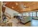 Spacious living room with vaulted wood ceiling and stone fireplace at 17210 Orangewood Dr, Lutz, FL 33548