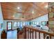 Living room with wood railing and vaulted ceiling at 17210 Orangewood Dr, Lutz, FL 33548