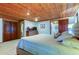 Main bedroom with wood ceiling and large dresser at 17210 Orangewood Dr, Lutz, FL 33548