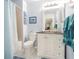 Clean bathroom with white vanity and tile shower at 1817 Hammocks Ave # 1817, Lutz, FL 33549