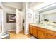 Large bathroom with double vanity, granite countertop, and a shower at 1817 Hammocks Ave # 1817, Lutz, FL 33549