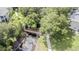 Footbridge over a tranquil waterway, with lush landscaping at 1817 Hammocks Ave # 1817, Lutz, FL 33549