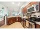 Modern kitchen with stainless steel appliances and granite countertops at 1817 Hammocks Ave # 1817, Lutz, FL 33549
