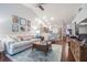 Living room with hardwood floors, vaulted ceiling, and open concept at 1817 Hammocks Ave # 1817, Lutz, FL 33549