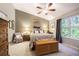 Spacious main bedroom with high ceilings, ceiling fan, and ample natural light at 1817 Hammocks Ave # 1817, Lutz, FL 33549