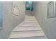 White staircase leading to upper level at 1817 Hammocks Ave # 1817, Lutz, FL 33549