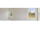 Bright bedroom with carpet flooring and large windows offering a view at 6257 Hidden Branch Dr, Apollo Beach, FL 33572