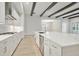 Modern kitchen featuring white cabinets, stainless steel appliances, and an island at 6257 Hidden Branch Dr, Apollo Beach, FL 33572
