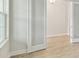 Bright office features light walls, wood-look floors, and large window at 6257 Hidden Branch Dr, Apollo Beach, FL 33572