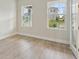 Bright office with wood-look floors and large windows at 6257 Hidden Branch Dr, Apollo Beach, FL 33572
