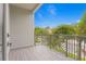 Private balcony overlooking the street with metal railing at 2442 W Mississippi Ave # 6, Tampa, FL 33629