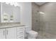 Modern bathroom with glass shower and white vanity at 2442 W Mississippi Ave # 6, Tampa, FL 33629