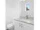 Modern bathroom with white vanity and gray countertop at 2442 W Mississippi Ave # 6, Tampa, FL 33629