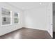 Bright bedroom with hardwood floors and ample natural light at 2442 W Mississippi Ave # 6, Tampa, FL 33629