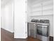 Convenient laundry room with washer, dryer, and shelving at 2442 W Mississippi Ave # 6, Tampa, FL 33629