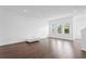 Bright living room with hardwood floors and large windows at 2442 W Mississippi Ave # 6, Tampa, FL 33629