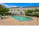 Community pool with lounge chairs and surrounding landscaping at 2442 W Mississippi Ave # 6, Tampa, FL 33629