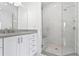 Spacious walk-in shower with marble tile and glass enclosure at 2442 W Mississippi Ave # 6, Tampa, FL 33629