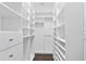 Spacious walk-in closet with custom shelving and rods at 2442 W Mississippi Ave # 6, Tampa, FL 33629