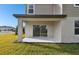 Covered patio with sliding glass doors at 10536 Hidden Banks Gln, Parrish, FL 34219