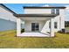 Covered patio with concrete flooring and grassy yard at 10627 Hidden Banks Gln, Parrish, FL 34219