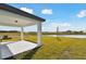 Covered patio overlooking a pond at 10627 Hidden Banks Gln, Parrish, FL 34219