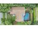 Aerial view of home with pool and landscaping at 6132 Silver Oaks Dr, Zephyrhills, FL 33542