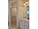 Bathroom with a shower and vanity with ample storage at 13417 Whitehaven Ct, Spring Hill, FL 34609