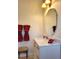 Bathroom with vanity, large mirror and red towels at 13417 Whitehaven Ct, Spring Hill, FL 34609