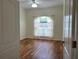 Bright bedroom with wood-look floors and sheer curtains at 13417 Whitehaven Ct, Spring Hill, FL 34609