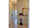 A hallway with tile floors and a decorative planter at 13417 Whitehaven Ct, Spring Hill, FL 34609