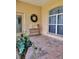 Relaxing screened porch with tiled flooring and view of backyard at 13417 Whitehaven Ct, Spring Hill, FL 34609