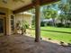 Screened porch with view of backyard and neighboring homes at 13417 Whitehaven Ct, Spring Hill, FL 34609