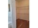 Large walk-in closet with wire shelving and hardwood floors at 13417 Whitehaven Ct, Spring Hill, FL 34609