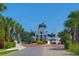 Picturesque community entrance to Little Harbor, framed by palm trees and lush landscaping with brick paved drive at 549 Bahia Beach Blvd, Ruskin, FL 33570