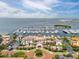 Picturesque aerial view of the waterfront property with a marina, lush landscaping, and beautiful buildings at 6030 Printery St # 105, Tampa, FL 33616