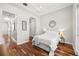 Cozy bedroom with hardwood floors, a modern decor, and a calming white color scheme at 6030 Printery St # 105, Tampa, FL 33616