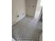 Bathroom with hexagon-patterned black and white floor tiles at 4021 W Santiago St, Tampa, FL 33629