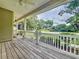 Spacious front porch overlooking a lush green yard at 12731 Timber Run, Dade City, FL 33525