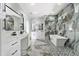 This spacious bathroom boasts a soaking tub, dual vanities, and sleek fixtures, perfect for relaxation at 2724 W Dewey St, Tampa, FL 33607