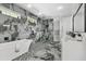 Stunning bathroom featuring a soaking tub, dual vanities, and a luxurious walk-in shower with marble accents at 2724 W Dewey St, Tampa, FL 33607