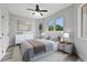 Comfortable bedroom with large windows, plush bedding, and modern minimalist furnishings at 2724 W Dewey St, Tampa, FL 33607