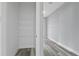 Walk-in closet with shelving and gray plank flooring at 2724 W Dewey St, Tampa, FL 33607
